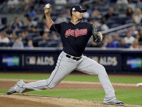 Cleveland Indians pitcher Carlos Carrasco (59) delivers against the New York Yankees during the first inning in Game 3 of baseball's American League Division Series, Sunday, Oct. 8, 2017, in New York. (AP Photo/Frank Franklin II)