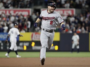 Minnesota Twins' Brian Dozier runs the bases after hitting a home run against the New York Yankees during the first inning of the American League wild-card baseball game Tuesday, Oct. 3, 2017, in New York. (AP Photo/Frank Franklin II)