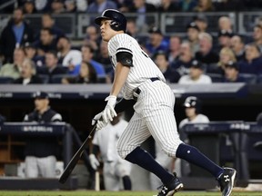 New York Yankees' Aaron Judge watches his two-run home run during the fourth inning of the American League wild-card baseball game against the Minnesota Twins on Tuesday, Oct. 3, 2017, in New York. (AP Photo/Frank Franklin II)