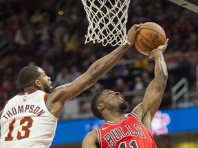 Cleveland Cavaliers' Tristan Thompson (13) blocks a shot by Chicago Bulls' David Nwaba (11) during the first half of an NBA preseason basketball game in Cleveland, Tuesday, Oct. 10, 2017. (AP Photo/Phil Long)
