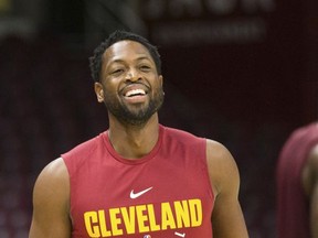 Cleveland Cavaliers' Dwyane Wade laughs during warmups prior to an NBA preseason basketball game against the Indiana Pacers, Friday, Oct. 6, 2017, in Cleveland. (AP Photo/Scott R. Galvin)