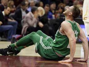 Boston Celtics' Gordon Hayward grimaces in pain in the first half of an NBA basketball game against the Cleveland Cavaliers, Tuesday, Oct. 17, 2017, in Cleveland. Hayward breaking his left ankle on a play. (AP Photo/Tony Dejak)