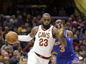 Cleveland Cavaliers' LeBron James (23) drives past New York Knicks' Tim Hardaway Jr. (3) in the first half of an NBA basketball game, Sunday, Oct. 29, 2017, in Cleveland. (AP Photo/Tony Dejak)