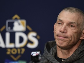 New York Yankees manager Joe Girardi listens to a question during a news conference before Game 2 of baseball's American League Division Series against the Cleveland Indians, Friday, Oct. 6, 2017, in Cleveland. (AP Photo/David Dermer)