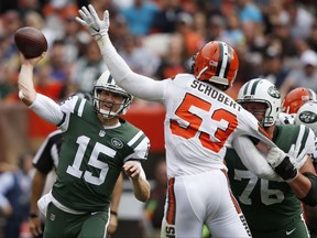 New York Jets quarterback Josh McCown (15) passes against Cleveland Browns outside linebacker Joe Schobert (53) during the first half of an NFL football game, Sunday, Oct. 8, 2017, in Cleveland. (AP Photo/Ron Schwane)