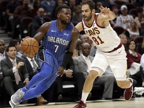 Orlando Magic's Shelvin Mack (7) drives past Cleveland Cavaliers' Jose Calderon (81), from Spain, in the second half of an NBA basketball game, Saturday, Oct. 21, 2017, in Cleveland. (AP Photo/Tony Dejak)