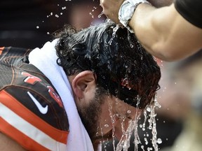 Cleveland Browns tackle Joe Thomas (73) is doused with water to cool down in the second half of an NFL football game against the Tennessee Titans, Sunday, Oct. 22, 2017, in Cleveland. (AP Photo/David Richard)