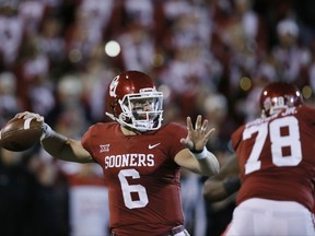 Oklahoma quarterback Baker Mayfield (6) throws in the first quarter of an NCAA college football game against Texas Tech in Norman, Okla., Saturday, Oct. 28, 2017. (AP Photo/Sue Ogrocki)