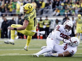 Oregon quarterback Braxton Burmeister runs the ball in the first quarter to set up a field goal against Washington State in an NCAA college football game Saturday, Oct. 7, 2017 in Eugene, Ore. (AP Photo/Thomas Boyd)