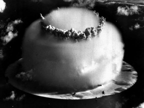 FILE - In this July 25, 1946 file photo, a huge mushroom cloud rises above Bikini atoll in the Marshall Islands following an atomic test blast, part of the U.S. military's "Operation Crossroads." Bikini Atoll in the Marshall Islands remains contaminated by radiation, part of a troubling nuclear testing legacy that continues to affect islands and people across the Pacific long after the U.S., Britain and France stopped their testing programs there. (AP Photo, File)