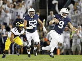 Penn State quarterback Trace McSorley (9) takes off running against Michigan during the first half of an NCAA college football game in State College, Pa., Saturday, Oct. 21, 2017. (AP Photo/Chris Knight)