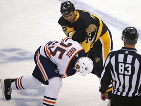 Pittsburgh Penguins' Ryan Reaves (75) fights with Edmonton Oilers' Darnell Nurse (25) in the first period of an NHL hockey game in Pittsburgh, Tuesday, Oct. 24, 2017. (AP Photo/Gene J. Puskar)