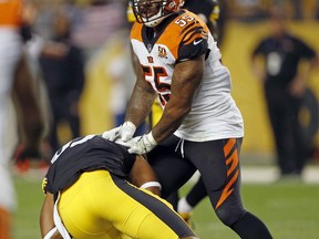 Cincinnati Bengals outside linebacker Vontaze Burfict (55) shoves Pittsburgh Steelers tight end Xavier Grimble (85) to the ground as he attempts to get up after catching a pass during the second half of an NFL football game in Pittsburgh, Sunday, Oct. 22, 2017. The Steelers won 29-14. (AP Photo/Keith Srakocic)