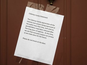 A message from Jim and Lyn Coleman is posted on their home in Stewartstown, Pa., Thursday, Oct. 12, 2017. The Coleman's daughter Caitlan Coleman, her Canadian husband and their three young children have been released after years held captive by a group that has ties to the Taliban and is considered a terrorist organization by the United States, U.S. and Pakistani officials said Thursday. (AP Photo/Matt Rourke)