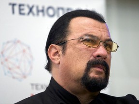 FILE - In this Sept. 22, 2015, file photo, actor Steven Seagal speaks at a news conference, while attending an opening ceremony for a research and development center in Moscow, Russia. Former heavyweight champion George Foreman took to Twitter on Oct. 3, 2017 to challenge Seagal to a 10-round fight. Seagal declined comment. (AP Photo/Ivan Sekretarev, File)