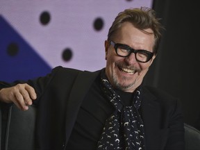 FILE - In this Sept. 11, 2017, file photo, Gary Oldman attends a press conference for "Darkest Hour" on day 5 of the Toronto International Film Festival at the TIFF Bell Lightbox in Toronto. Dick Clark Productions announced Oldman will receive a career achievement award at the Hollywood Film Awards Sunday, Nov. 5, 2017. (Photo by Evan Agostini/Invision/AP, File)