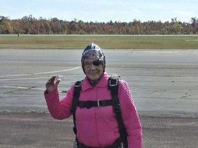 This Sunday, Oct. 22, 2017, photo provided by Eric Fox shows Eila Campbell, of Williamsport, Pa., waving as she celebrates her 94th birthday by going skydiving with her granddaughter and great-granddaughter at Above the Poconos Skydivers at Hazleton Regional Airport in Hazleton, Pa. Each woman jumped separately but in tandem with an instructor, and Campbell described the free fall as "kind of a wow" and says she'd skydive again. (Eric Fox via AP)