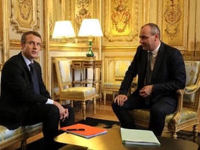Democratic Confederation of Labour (CFDT) union's general secretary, Laurent Berger, right, poses with French President Emmanuel Macron ahead of a meeting at the Elysee Palace in Paris, Friday Oct. 13, 2017. Macron is launching step two of his campaign to rethink French labor law, this time focusing on unemployment benefits and job training. (ludovic Marin, Pool via AP)