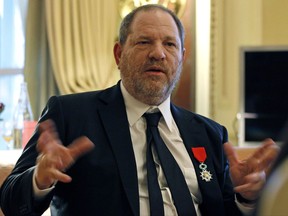 FILE - In this March 7, 2012 file photo, U.S film producer and movie studio chairman Harvey Weinstein during an interview with the Associated Press in Paris, the same day as Weinstein received, Chevalier of the Legion of Honor by French President Nicolas Sarkozy. French President Emmanuel Macron says Sunday Oct. 15, 2017 that he wants to revoke Harvey Weinstein's Legion of Honor award after the wave of accusations of sexual harassment and abuse against the Hollywood titan. (AP Photo/Remy de la Mauviniere, File)