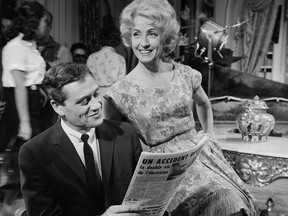 FILE - In this Aug. 2, 1960 file photo, American actor Mel Ferrer and French actress Danielle Darrieux portray the roles of man and wife in a scene from the French film "L'homme a Femmes," based on Patrick Quentin's novel "Shadow of a Guilt", in Paris. Darrieux, a prolific French actress whose movie and theater career spanned eight decades, has died. She was 100. (AP Photo/Max Micol, File)