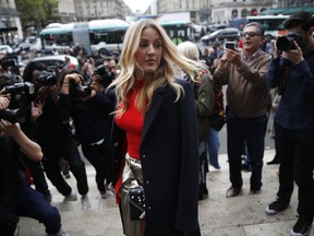 British singer Ellie Goulding arrives at Stella McCartney's Spring-Summer 2018 ready to wear fashion collection in Paris, Monday, Oct.2, 2017. (AP Photo/Christophe Ena)