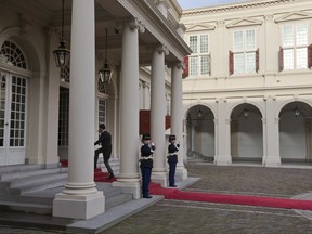 Caretaker Prime Minister Mark Rute enters the palace as he arrives for the swearing-in ceremony of the new Dutch government at Royal Palace Noordeinde in The Hague, Netherlands, Thursday, Oct. 26, 2017. (AP Photo/Peter Dejong)