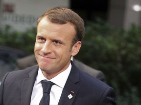 French President Emmanuel Macron arrives for an EU summit in Brussels on Friday, Oct. 20, 2017. European Union leaders conclude a two day summit on Friday in which they discussed migration, digital economy and Brexit. (AP Photo/Olivier Matthys)