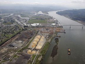 FILE- This May 12, 2005, file photo, shows the port of Longview on the Columbia River at Longview, Wash. A judge says Washington state's Department of Natural Resources acted arbitrarily when it blocked a sublease sought by developers of a proposed coal-export terminal near Longview. (AP Photo/Elaine Thompson, File)