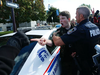 City police escort a man who was punched during the protests on Saturday Sept. 30, 2017 in Peterborough, Ont.