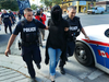 Police arrest a protester on Saturday Sept. 30, 2017 in Peterborough, Ont.