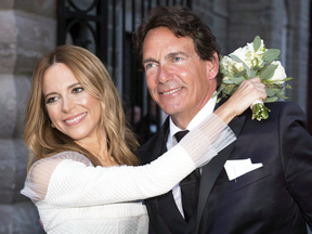 Pierre Karl Péladeau and Julie Snyder hug after getting married in Quebec City on Aug. 15, 2015. In January 2016 the couple announced they were seeking a divorce.
