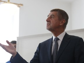 Czech billionaire and leader of the ANO 2011 political movement Andrej Babis gestures before casting his vote during the parliamentary elections in Pruhonice, Czech Republic, Friday, Oct. 20, 2017. Czechs are voting in a parliamentary election whose result could see yet another euro-skeptic government on the continent. Two hundred seats are up for grab in the lower house of Parliament in the two-day ballot that began on Friday. (AP Photo/Petr David Josek)