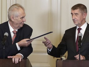 Czech Republic's President Milos Zeman, left, asks billionaire and leader of ANO 2011 political movement Andrej Babis, right, to try to form a new government during a press conference in Lany, Czech Republic, Tuesday, Oct. 31, 2017. Babis' centrist ANO (YES) movement won 78 seats in the 200-seat lower house of Parliament earlier in October in Czech Republic's general elections. (AP Photo/Petr David Josek)