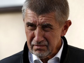 FILE - In this file picture taken Wednesday, Oct. 4, 2017, Czech billionaire and leader of the ANO 2011 political movement Andrej Babis arrives for a political debate at the village of Vsetaty, Czech Republic, Czech Republic is holding general elections from Oct. 20 to 21, 2017. Babis, a former finance minister and billionaire whose political grouping is a hot favorite to win next month's parliamentary election has been charged by police with fraud involving EU subsidies as it was announced Monday, Oct. 9, 2017. (AP Photo/Petr David Josek, file)