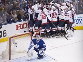 In this April 23 file photo, Washington Capitals players celebrate their first-round series win over the Toronto Maple Leafs.