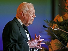 In this Jan. 27, 2017 file photo, former President Jimmy Carter speaks in Phoenix. Carter has been treated for dehydration while volunteering with Habitat for Humanity in Winnipeg.