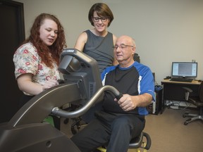Neuroscientist Dr. Lara Boyd (centre) leads a unique study following bike-riding stroke patients at UBC’s Djavad Mowafaghian Centre for Brain Health.