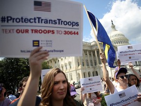 Gay rights supporters protest President Donald Trump's proposed ban on transgendered service members on July 26, 2017, in Washington, D.C.
