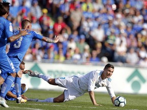 Real Madrid's Cristiano Ronaldo falls during a Spanish La Liga soccer match between Getafe and Real Madrid at the Coliseum Alfonso Perez in Getafe, Spain, Saturday, Oct. 14, 2017. (AP Photo/Paul White)