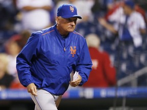 New York Mets manager Terry Collins runs to the dugout before the start of a baseball game against the Philadelphia Phillies, Friday, Sept. 29, 2017, in Philadelphia. (AP Photo/Laurence Kesterson)