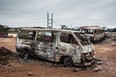 A picture taken on October 8, 2017 in Accra shows burnt vehicles on the site where a gas tanker caught fire, triggering explosions at two fuel stations on the evening of October 7, 2017.  
At least three people were killed and dozens injured after a tanker truck carrying natural gas caught fire in Ghana's capital, Accra, triggering explosions at two fuel stations, emergency services said.