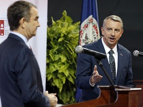 Republican gubernatorial candidate, Ed Gillespie, right, gesturing a debate with Democratic challenger Lt. Gov. Ralph Northam on Oct. 9, 2016, at the University of Virginia-Wise in Wise, Va.