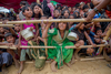Rohingya children, who crossed over from Myanmar into Bangladesh, wait for their turn to receive food at Thaingkhali refugee camp, Bangladesh, Oct. 21, 2017.