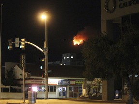 A fire burns atop Mount Wilson, seen from Pasadena, Calif., northeast of Los Angeles on Tuesday, Oct. 17, 2017.  The fire erupted in the early morning on the 5,713-foot (1,741-meter) peak, near the region's TV and radio broadcast towers and the historic Mount Wilson Observatory.  (AP Photo/John Antczak)