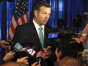 In this June 8, 2017 file photo, Kansas Secretary of State Kris Kobach speaks to supporters in launching his campaign for the Republican nomination for governor, in Lenexa, Kan. Kobach once wrote a letter as a 20-year-old student denouncing racial segregation in South Africa but arguing that U.S. corporations shouldn't pull out. (AP Photo/John Hanna File)