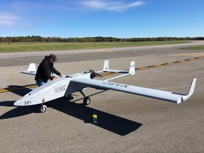In this Oct. 17, 2017 photo, Mike Busutil of Navmar Applied Sciences Corporation prepares to do flight tests with a Tigershark drone at Griffiss International Airport in Rome, N.Y. New York state is investing $30 million to create a 50-mile drone-testing corridor between Rome and Syracuse. (AP Photo/Mary Esch)
