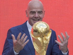 FIFA president Gianni Infantino and the FIFA World Cup trophy in Moscow on Saturday, Sept. 9, 2017.
