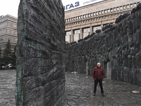 The artist Georgy Frangulyan in front of his work, “Wall of Grief,” a government-sponsored monument commemorating victims of political repression during the Soviet era, in Moscow, Oct. 13, 2017.