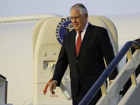 Secretary of State Rex Tillerson steps off his plane as he arrives at King Salman Air Base, Saturday, Oct. 21, 2017, in Riyadh, Saudi Arabia. (AP Photo/Alex Brandon, Pool)