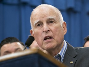 FILE - In this July 17, 2017 file photo Gov. Jerry Brown speaks at a Capitol news conference in Sacramento, Calif. Brown signed "sanctuary state" legislation Thursday, Oct. 5 that extends protections for immigrants living in the United States illegally -- a move that gives the nation's most populous state another tool to fight President Donald Trump.  (AP Photo/Rich Pedroncelli, File)